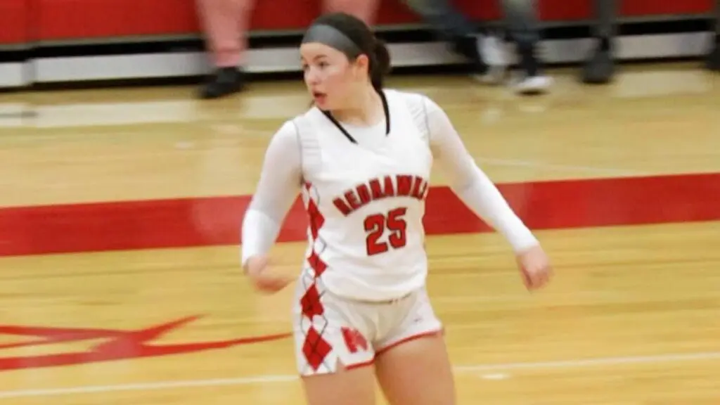 Erin Hackett runs back on defense for Naperville Central.