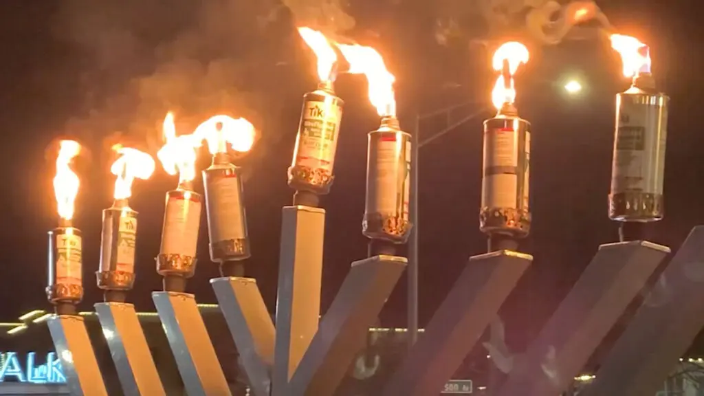 Giant menorah lighting in front of Nichols Library