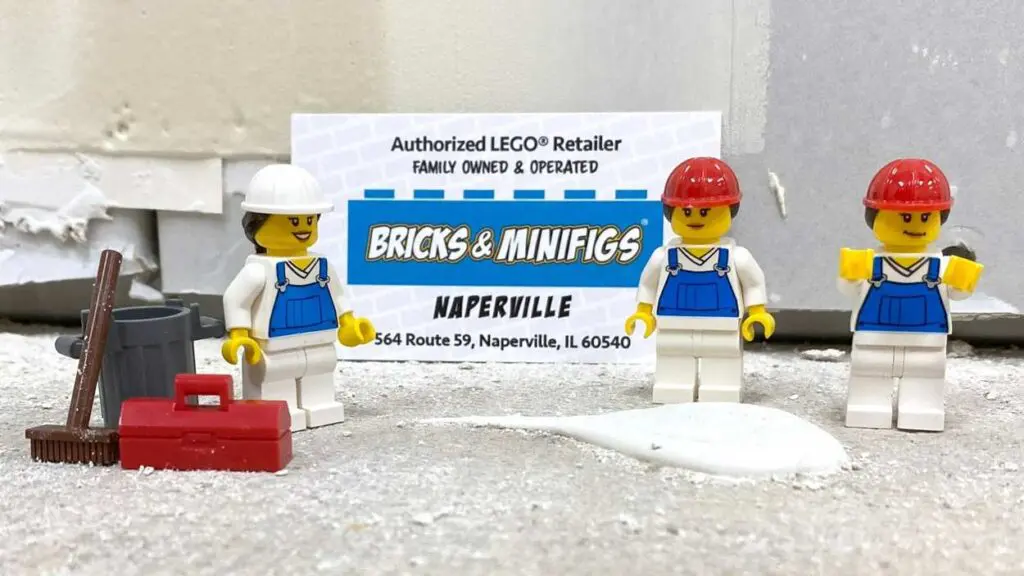 Three Lego minifigures next to an information card for the Bricks & Minifigs Naperville
