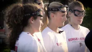 Benet girls lacrosse captains talk to the Nazareth captain before the game.