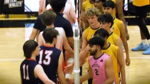 Metea Valley boys volleyball shakes hands with North after a two-set victory.