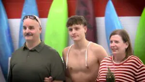 Naperville Central boys water polo senior Aj Landorff walks out for Senior Night with his family.