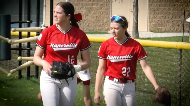 Naperville Central softball gets ready to take the field against Waubonsie Valley.