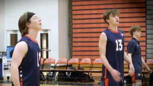 Naperville North boys volleyball warms up before playing Naperville Central.