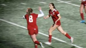 Nicole Smith celebrates her goal for Naperville Central girls soccer.
