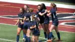 Allessandra Russo and Selma Larbi hug after connecting on the goal.