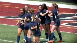 Allessandra Russo and Selma Larbi hug after connecting on the goal.