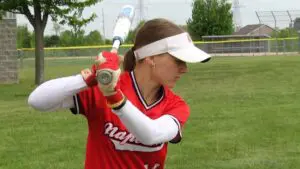 Naperville Central softball player warms up