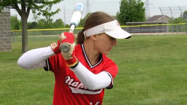 Naperville Central softball player warms up
