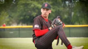 Jake Rifenburg warms up for Benet Academy Baseball before the IHSA Regional Semifinal against Glenbard South.