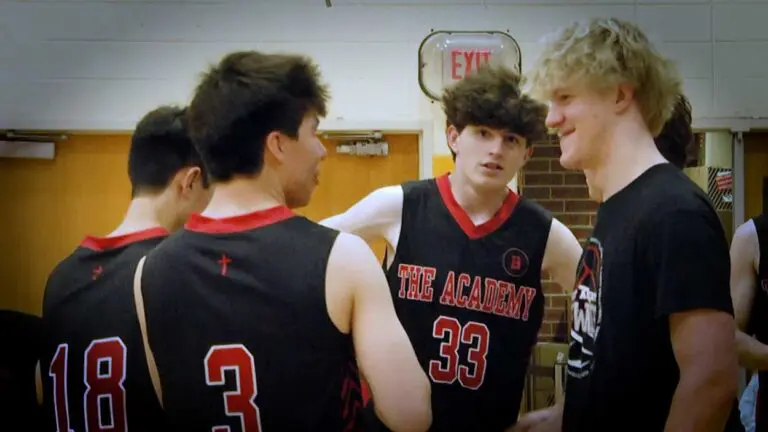 Benet boys volleyball players talk before the game against Neuqua Valley.