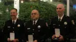 Three members of the Naperville Police Department hold the awards they received during the CAPS Awards at Meson Sabika. Each year, CAPS honors several members of the Naperville Police Department.