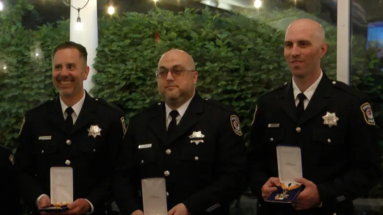 Three members of the Naperville Police Department hold the awards they received during the CAPS Awards at Meson Sabika. Each year, CAPS honors several members of the Naperville Police Department.