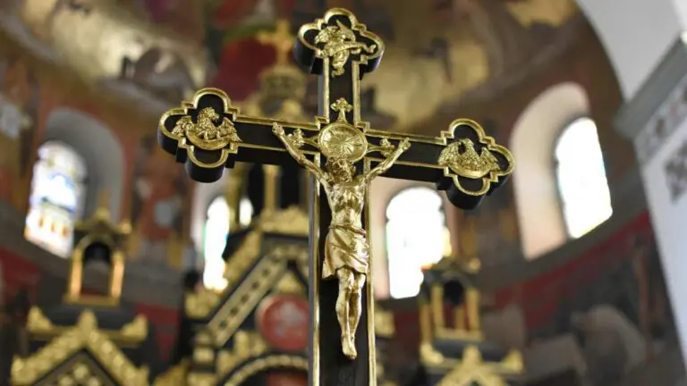 A picture of a black and gold crucifix