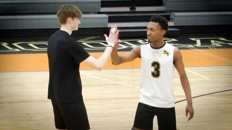 Hinsdale South boys volleyball players do a pre-game handshake before playing Naperville Central.