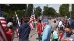A group of veterans carrying flags during 2025 Naperville Memorial Day Parade