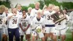 Neuqua Valley boys lacrosse celebrates with the IHSA Sectional plaque.