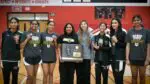 Metea Valley smiles with the IHSA Girls Badminton Sectional plaque at Naperville Central High School.