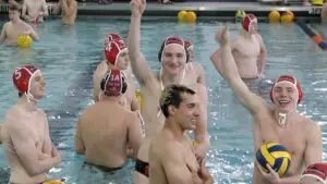 Naperville Central boys water polo team smiles and waves to camera before the IHSA Quarterfinal against Metea Valley.
