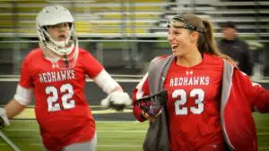 Naperville Central girls lacrosse team runs out for stick checks against The Valley Co-Op.
