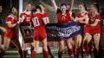 Naperville Central girls soccer celebrates DVC win over Waubonsie.