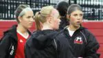 Naperville Central girls soccer players talk before playing Bolingbrook.
