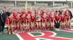 Naperville Central girls soccer smiles with the IHSA Regional Plaque after beating Lockport.