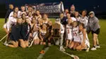 Naperville North girls lacrosse on top of the DVC mountain