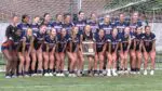 Naperville North Girls Soccer smiles with the Regional plaque after beating Oswego.