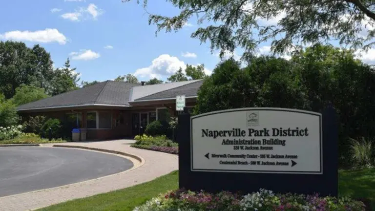 Wide shot of Naperville Park District Administration Building with sign for the building in foreground for story on financial roadmap for district