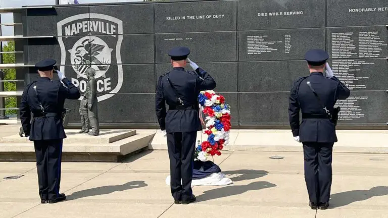 Three officers saluting