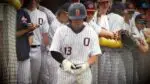 Oswego Baseball player walks out to open the game against Naperville North in the IHSA Regional Semifinals.