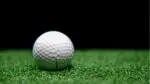 A golf ball sits on a turf for a news story about Clubhouse540 in Naperville, a planned indoor golfing facility.