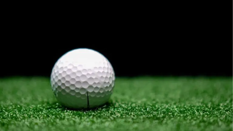 A golf ball sits on a turf for a news story about Clubhouse540 in Naperville, a planned indoor golfing facility.