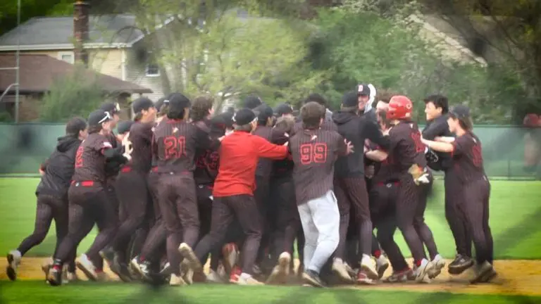 Benet baseball celebrates Quinn Rooney hitting the walk-off against Naperville North.