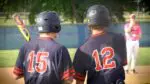 Naperville North baseball players talk before hitting against Neuqua Valley.