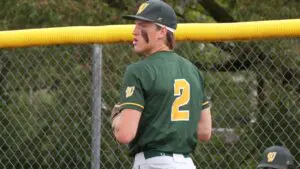 Owen Roberts warms up for Waubonsie Valley baseball
