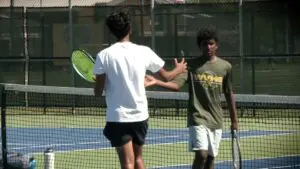 Waubonsie’s Revanth Kothapalli and Ishan Suresh Kumar high five during the DVC One Doubles Championship.