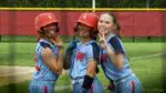 West Aurora Softball players smile and look at the camera before the IHSA Regional Semifinal against Naperville Central.