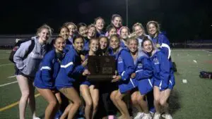 Wheaton North poses with trophy at the Rolling Meadows girls track and field sectional