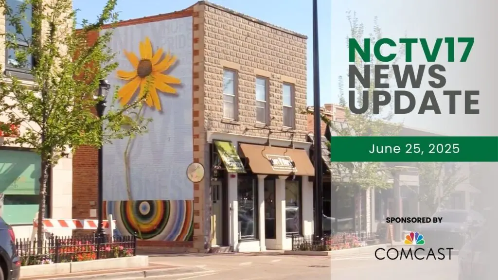 A photo of the "Towering Sunflower" art mural, the same wall where the upcoming ArtForum mural will go