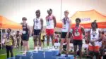 Naperville Central’s Zoelen Terry stands on top of the podium at the IHSA Boys Track and Field Championship.