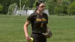 Charlie Benesh warms up for Metea Valley softball.