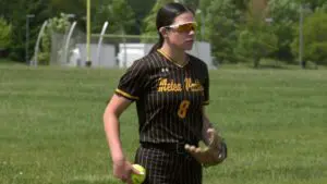 Charlie Benesh warms up for Metea Valley softball.