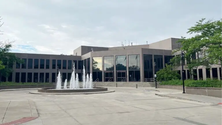 The Naperville Municipal Center with the water fountain on for story on city council debating timing and scope of electricity workshops