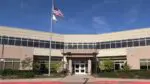 Wide shot of exterior of Indian Prairie School District 204 administration building for story about former Neuqua teacher returning as student services director