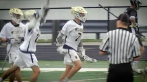 Number 7, Jonah Frank, celebrates after beating the Record in the IHSA Boys Lacrosse Sectional.