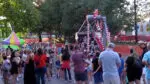 Naperville community members stand around ride at the city's Last Fling event. Event organizers have implemented several new changes in line with the city's new safety recommendations for large events.