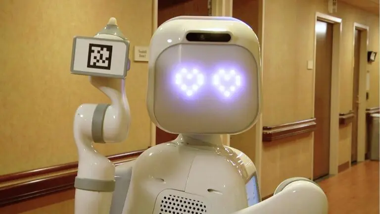 A Moxi robot at Endeavor Health Edward Hospital poses for a picture with heart eyes on its face.
