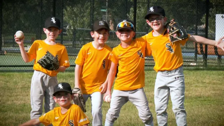 Players from NCTV Naperville Little League Rookies A Team Schuiling pose for a picture to the camera.